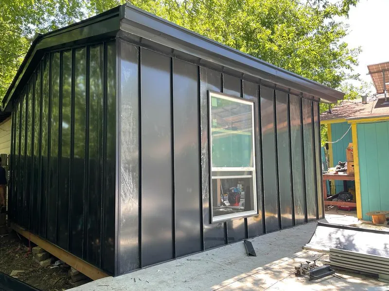 Black standing seam metal wall panels for Metal Roof Installation in Stroud